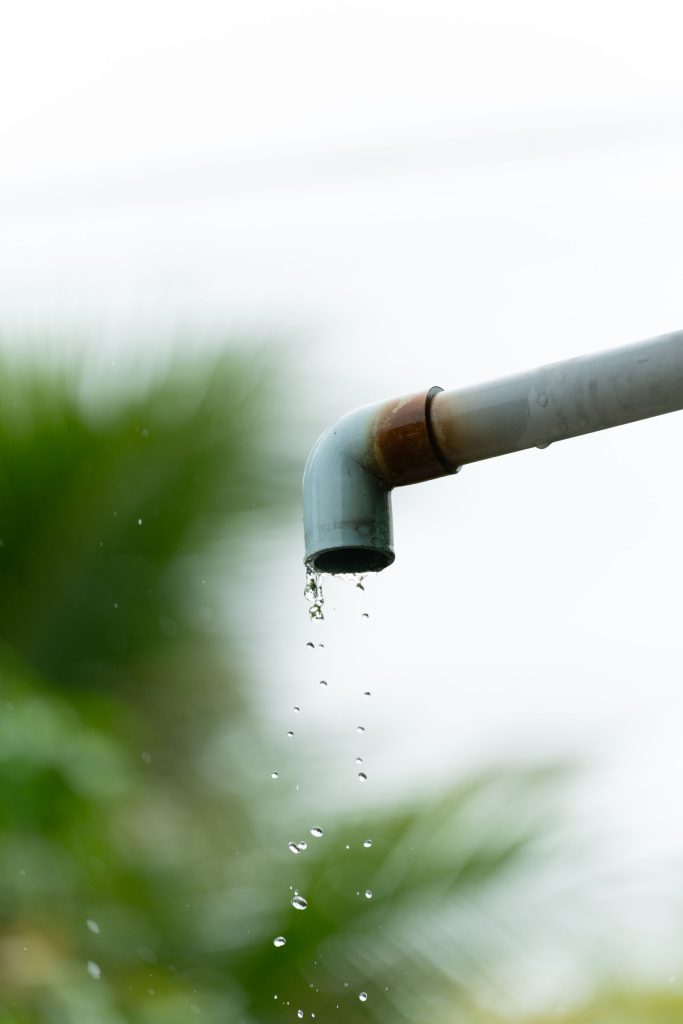 Water dripping from a rusty pipe